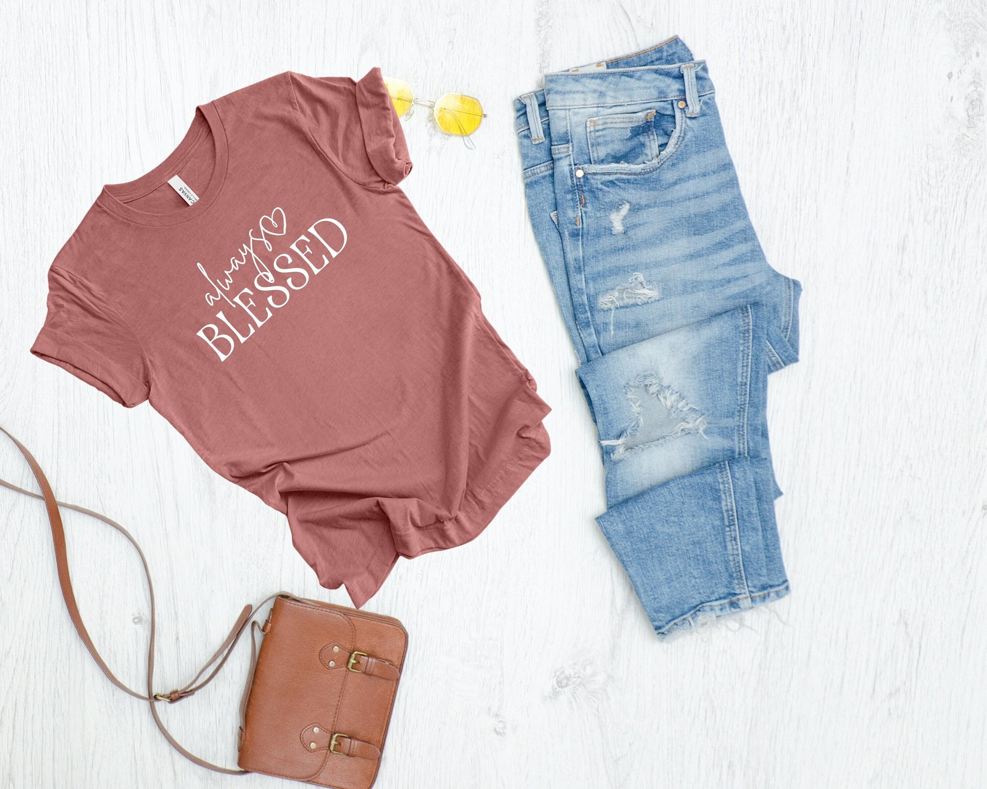 Soft tee shirt with the words Always Blessed in a combo of script and sans caps. Always has a heart on the end.